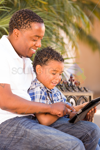Stock Photo Of Happy African American Dad And Mixed Race Son Enjoying Browsing Tablet Outdoors Vertical - African American Dad, Transparent background PNG HD thumbnail
