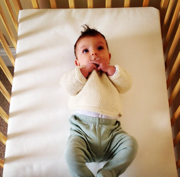 baby standing on crib