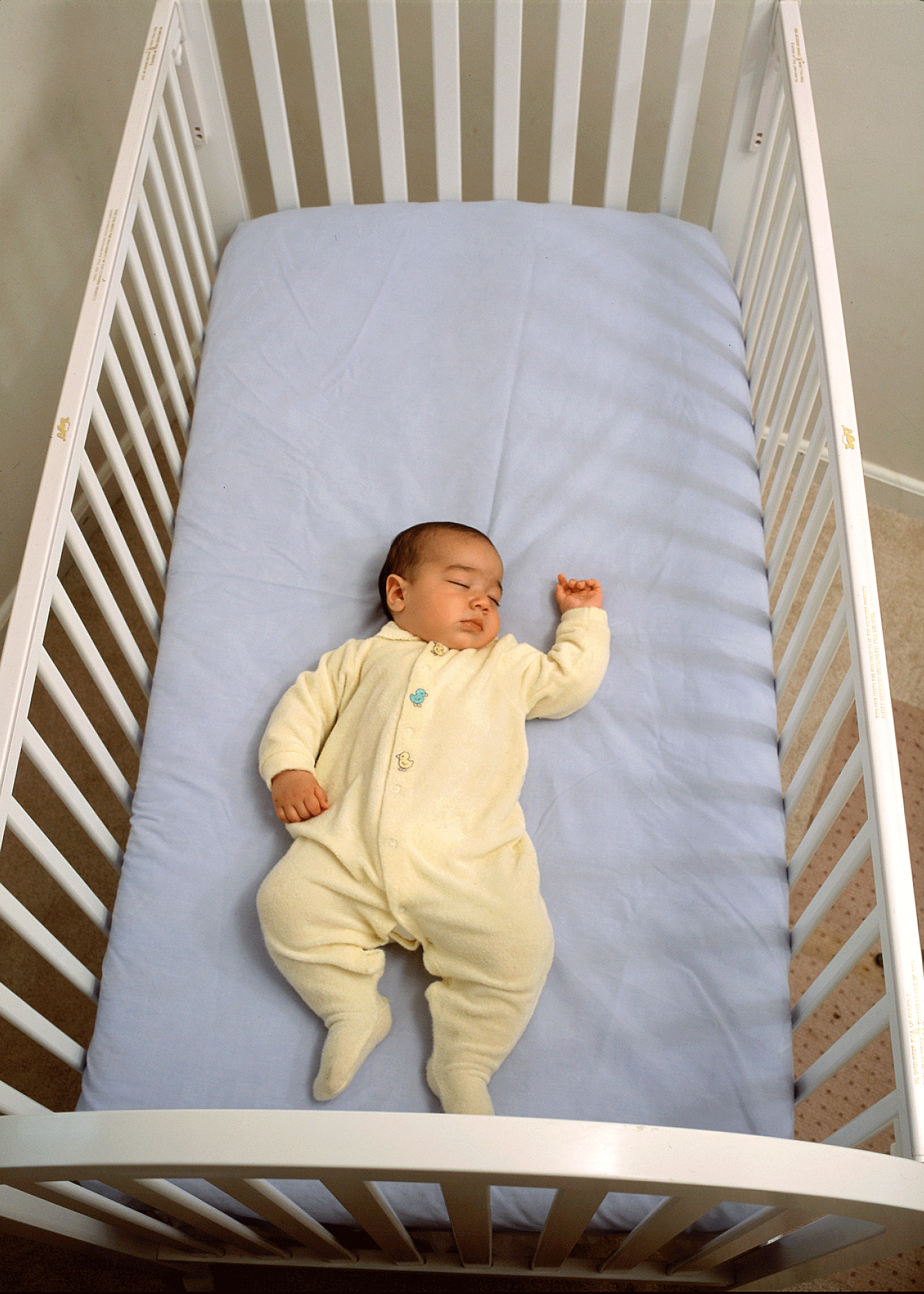 baby standing on crib