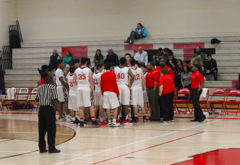 The Boys Varsity Basketball Team Huddles During Home Game Against Wisconsin Lutheran. - Basketball Team Huddle, Transparent background PNG HD thumbnail