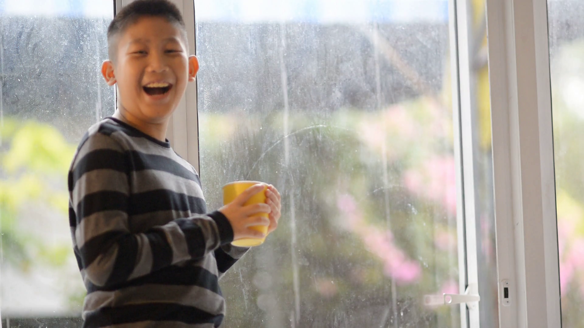 Asian Boy Drinks Tea, Juice Or Hot Chocolate Standing At The Windowsill And Looking Out Window In Rainy Day Stock Video Footage   Videoblocks - Boy Looking Out Window, Transparent background PNG HD thumbnail