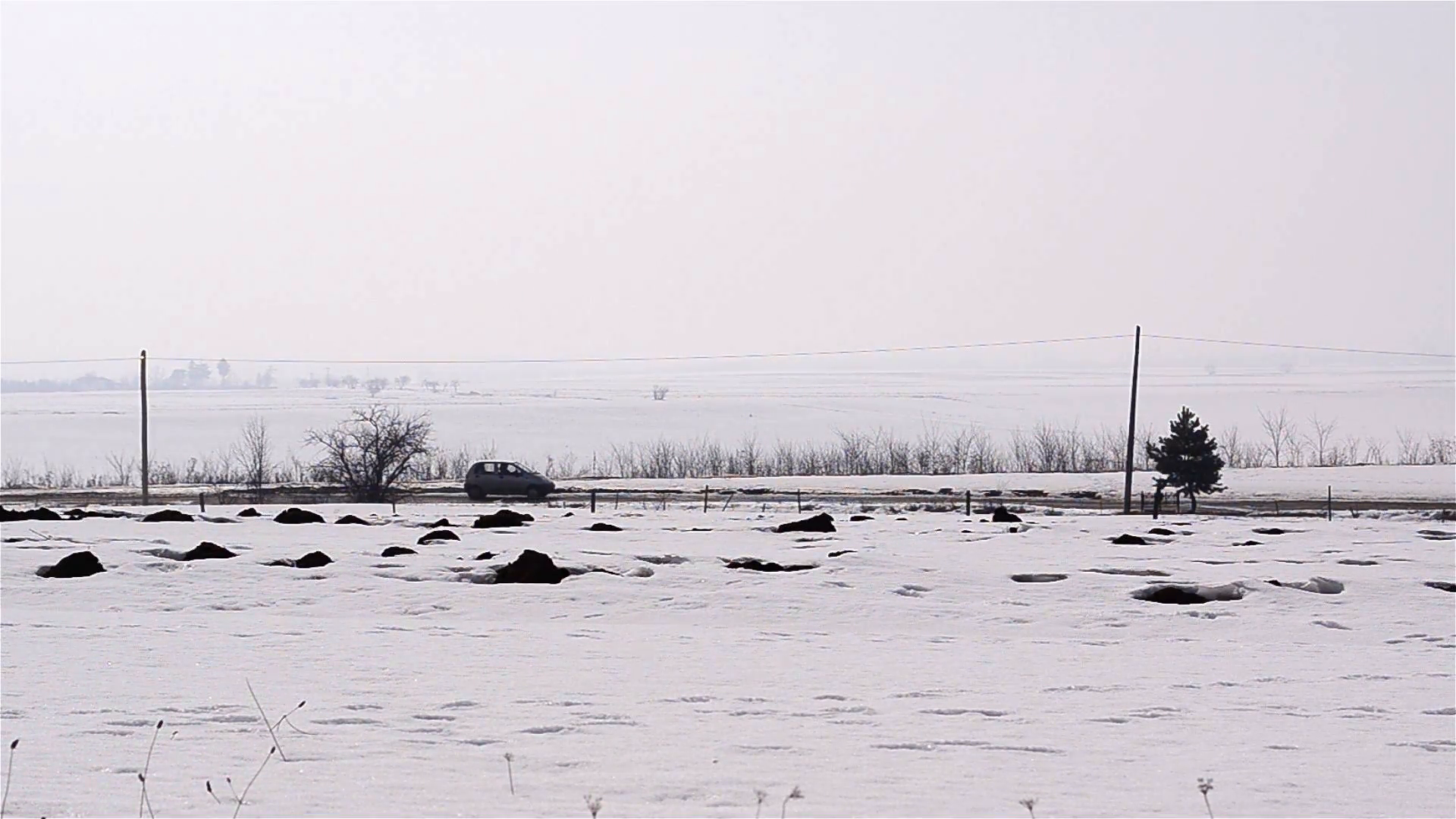 Car Goes On A Road Bordered By Farm Fields Covered With Snow 1 Stock Video Footage   Videoblocks - Farm Fields Black And White, Transparent background PNG HD thumbnail