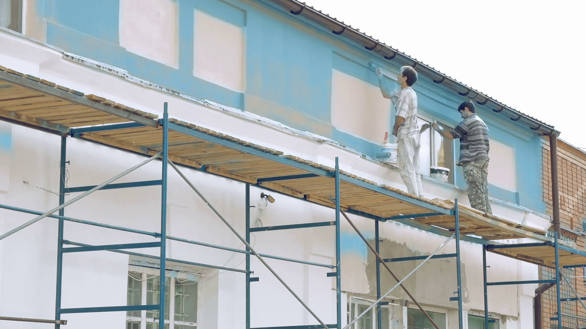 Professional Workers Painting By Paintbrush Building Wall In Blue Color Outdoors. House Painter Men At Work Action At Summer Day. - House Painter, Transparent background PNG HD thumbnail