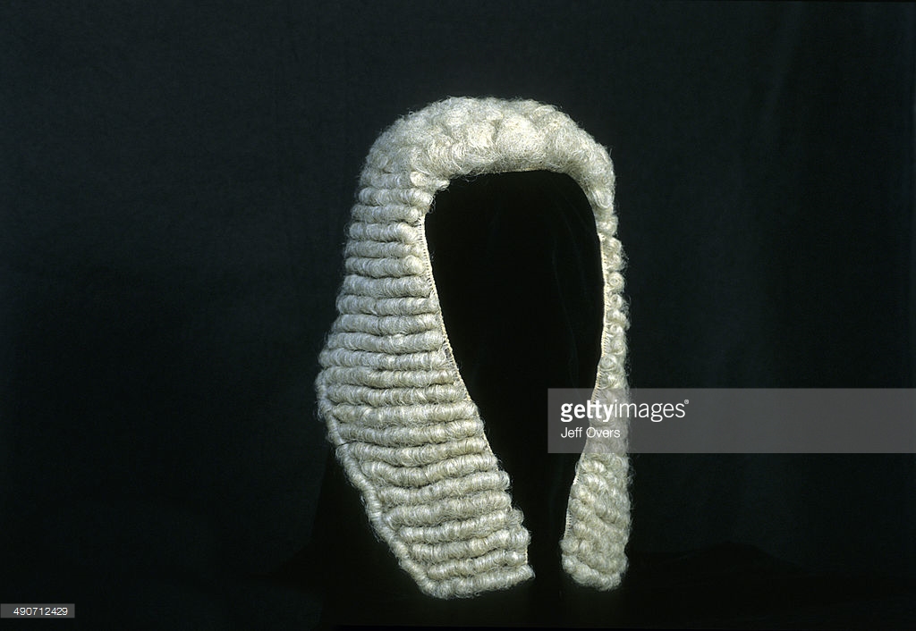 Judge wig on a white backgrou