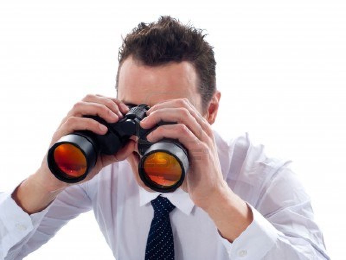 Man looking through binocular