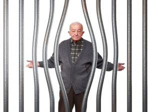Old man behind bars