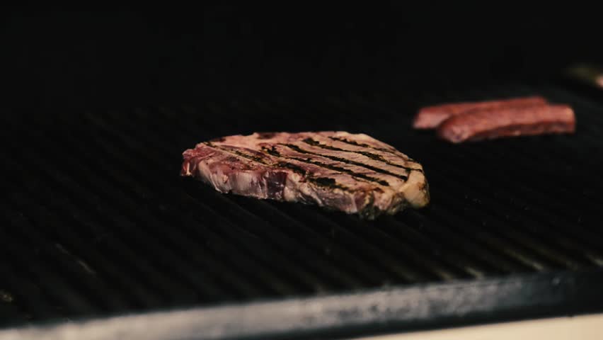 Steak Getting Cooked On The Barbecue With Naked Flames.   Hd Stock Footage Clip - Steak, Transparent background PNG HD thumbnail