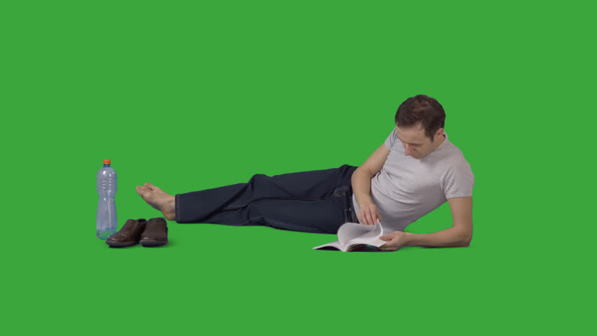 Attractive Barefooted Man Is Lying On Side And Reading Book. Footage With Alpha Channel. - Tall Man, Transparent background PNG HD thumbnail