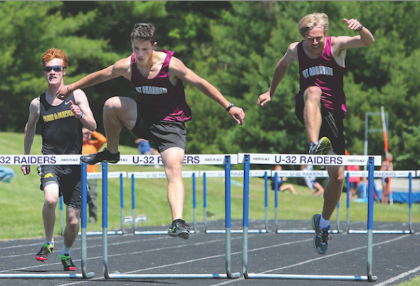 Hurdlers compete in the Distr